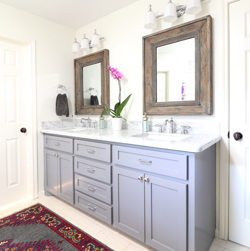 Master bathroom Lake Jackson Texas gray cabinets white countertops colorful rug